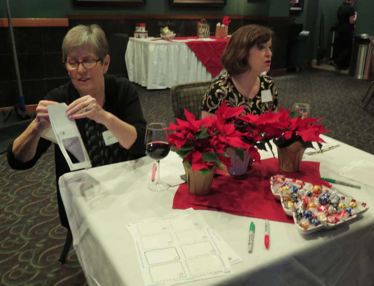 Susan and Valerie manage sign-in and name badge distribution