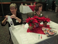 Susan and Valerie manage sign-in and name badge distribution