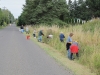 Volunteer work party snipping thistles along Woodcock