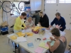 Volunteers preparing envelopes for annual meeting mailing
