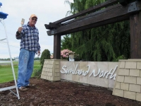 Eric Mahnerd overhauled our entrance sign, wife Kathy planted flowers!